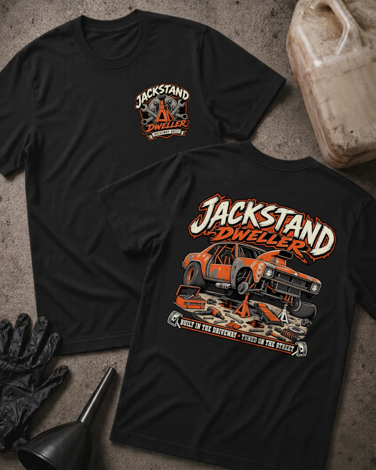 Front and back of black Jackstand Dweller T-shirt with a small chest emblem and large orange project car on jack stands graphic on the back.