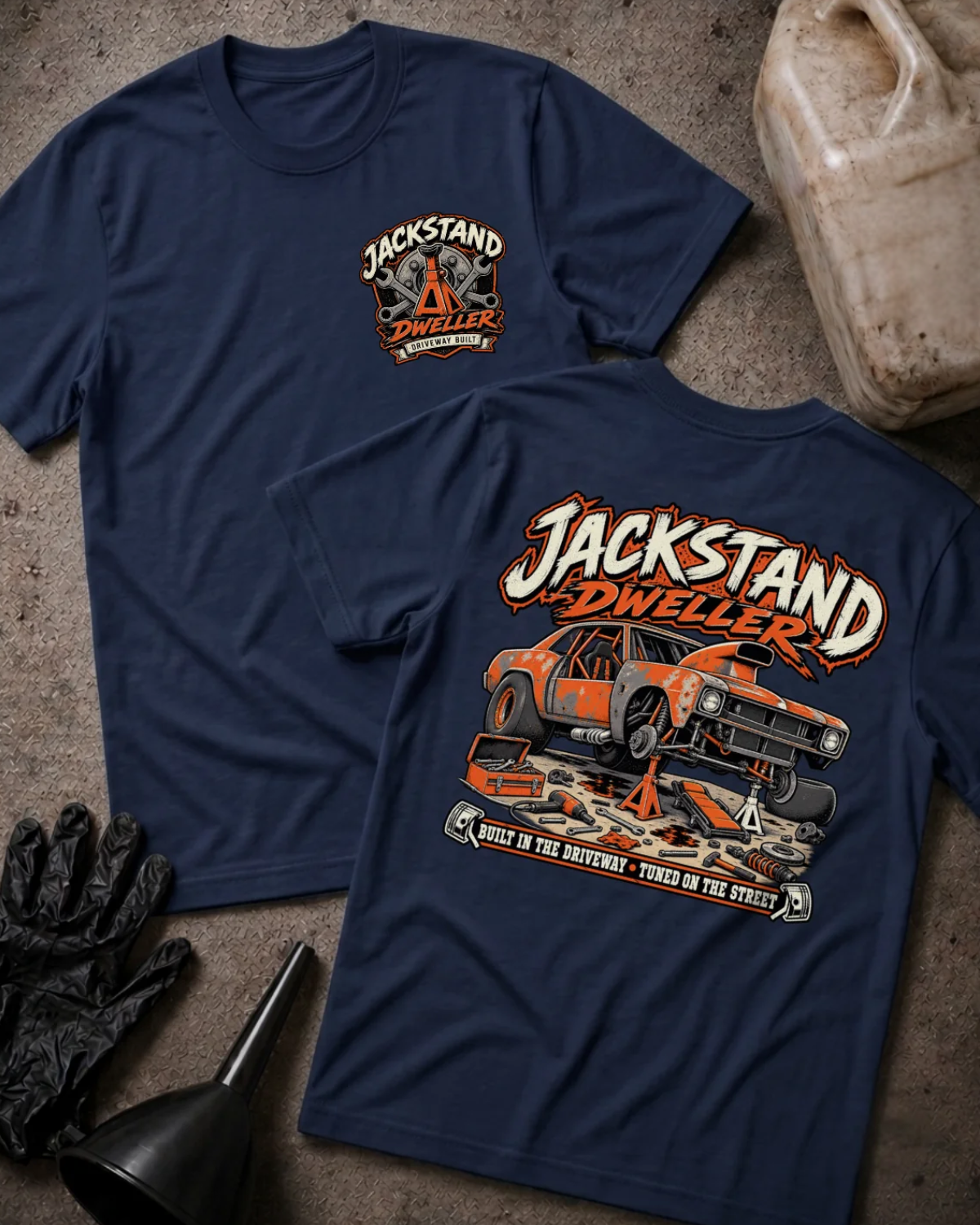 Front and back of navy Jackstand Dweller T-shirt with a small chest emblem and large orange project car on jack stands graphic on the back.