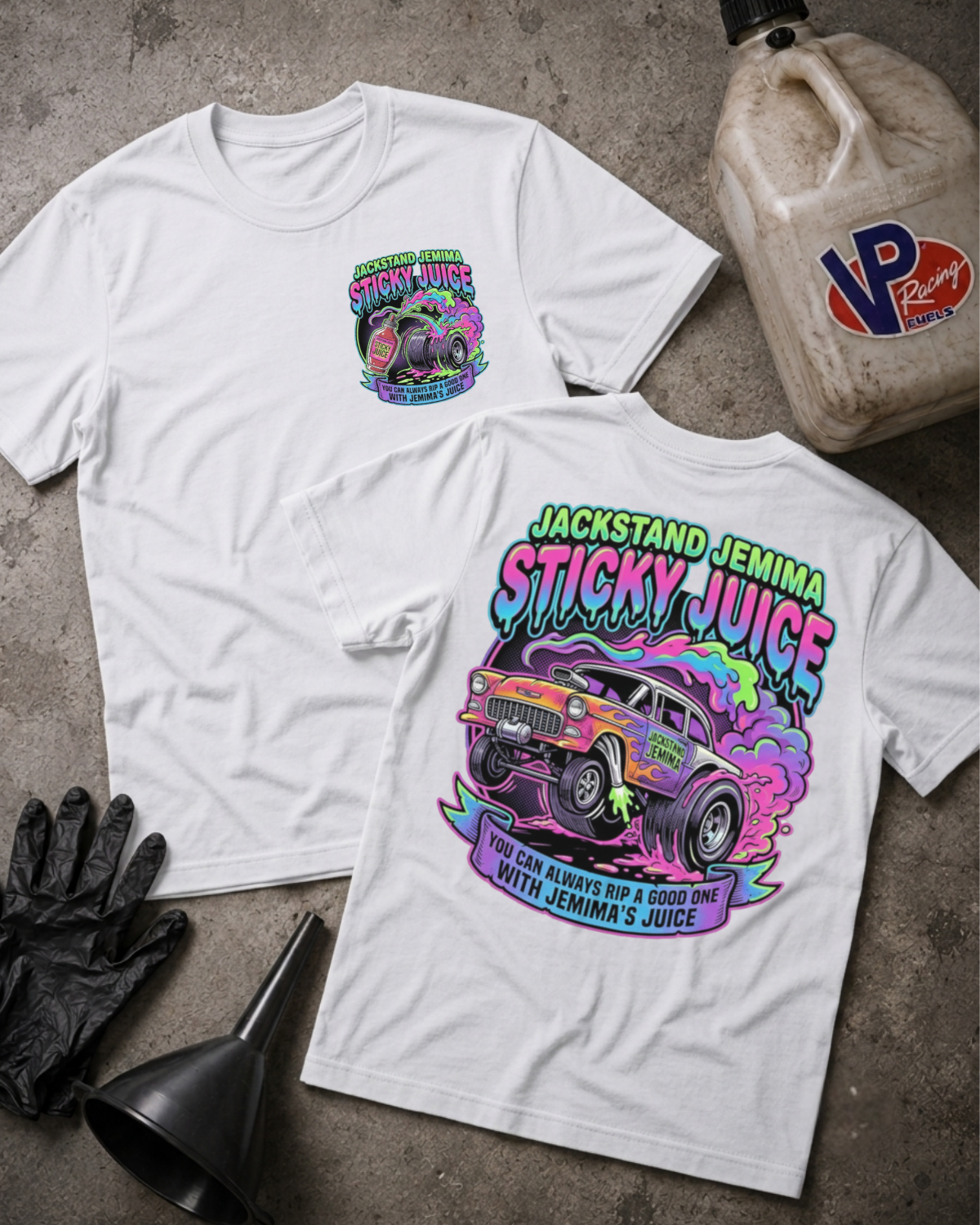 Two white graphic T-shirts laid flat on a gray concrete surface, showing the front and back designs. The shirts feature a colorful hot rod car and neon-style text reading 'Jackstand Jemima Sticky Juice.