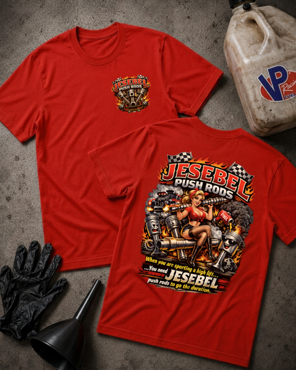 Two red graphic T-shirts laid flat on a gray concrete-like surface, with a fuel jug, black gloves, and black funnel as styled props. The front shirt shows a small chest graphic, and the back shirt shows a large graphic with the text 'Jesebel Push Rods' and additional graphic elements.