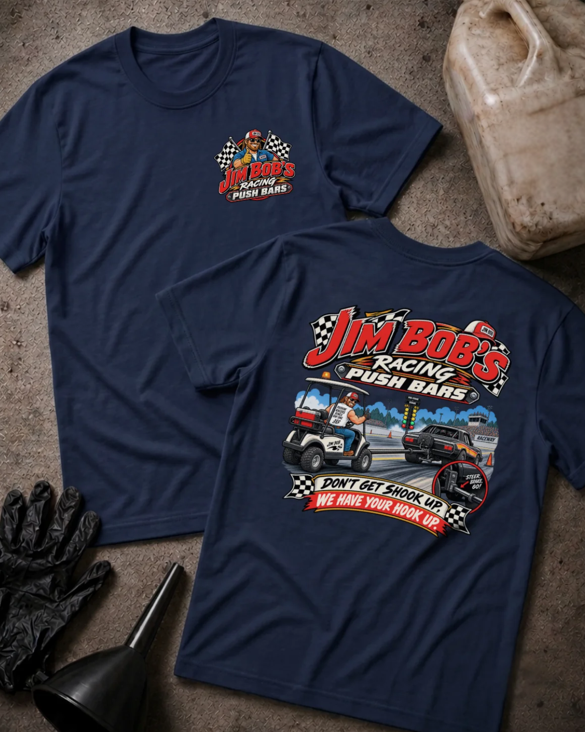 Front and back of Jim Bob’s Racing Push Bars navy T-shirt with chest logo, man driving a golf cart behind a drag car, and “Don’t get shook up. We have your hook up.” slogan.