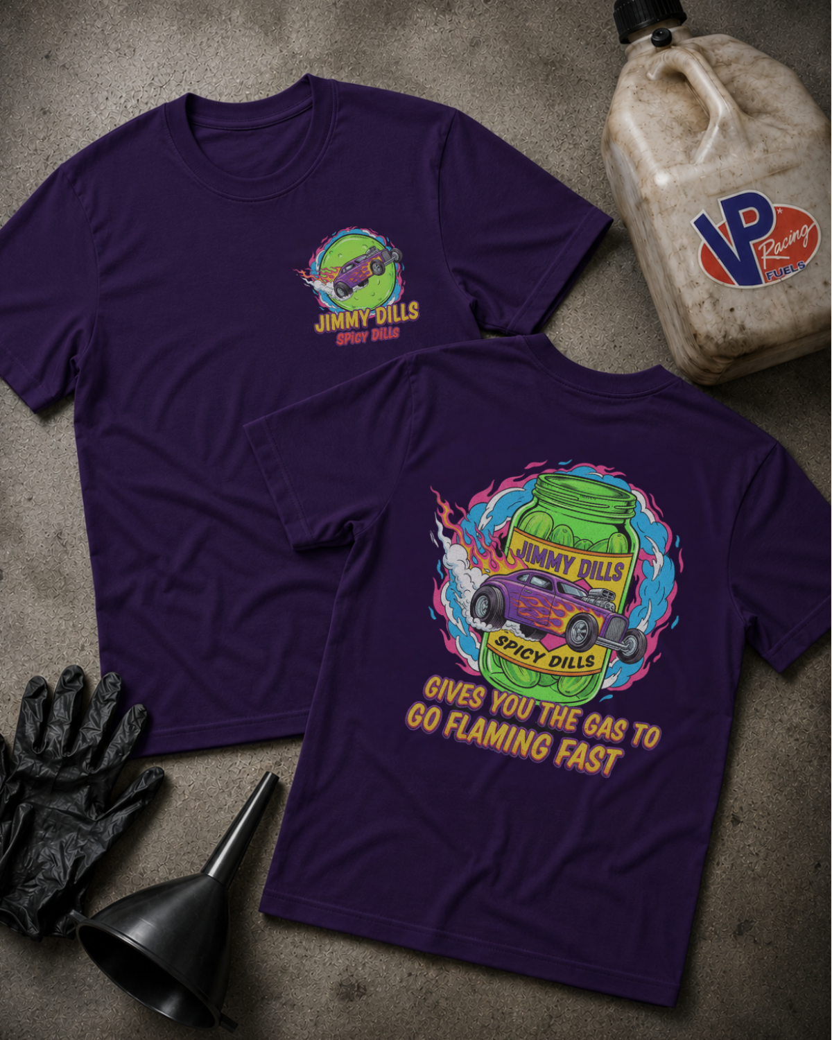 Team purple t-shirt with 'Jimmy Dlls Spicy Dills' logo on the front and a graphic design of a pickle jag and hot rod with text 'Jimmy Dills Spicy Dills Gives You The Gas To GoFlaming Fast'