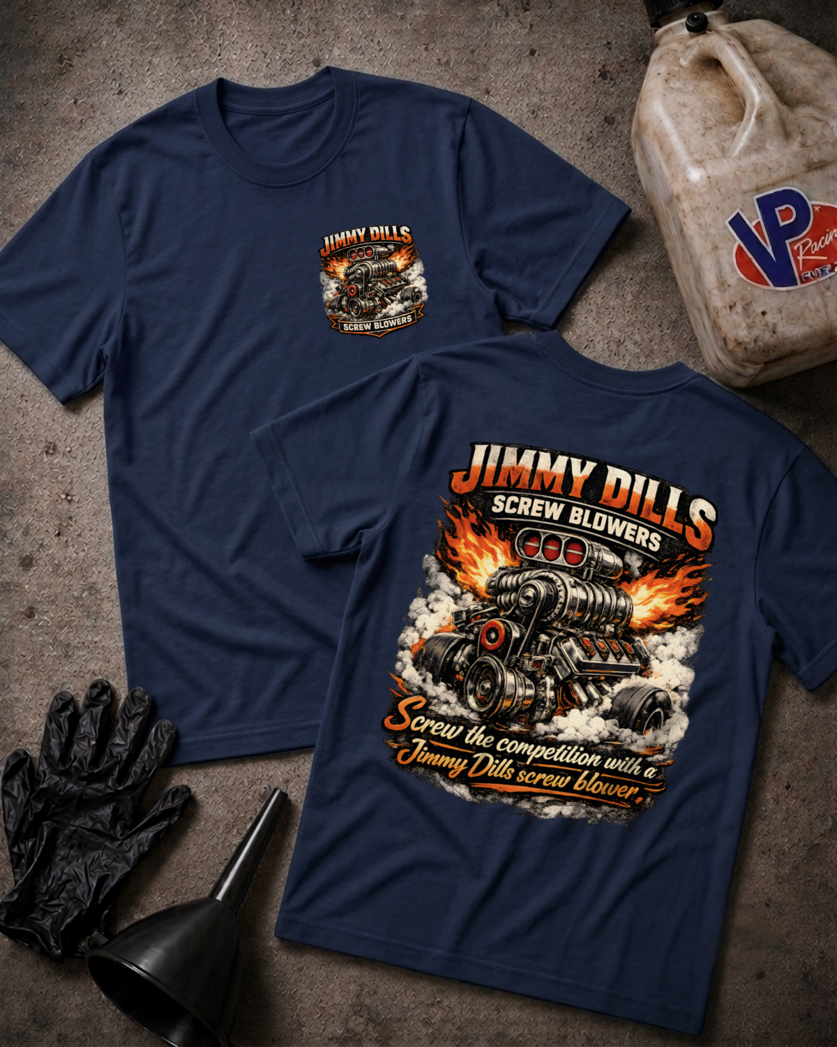 Two navy blue graphic t-shirts displayed flat on a textured gray surface, showing both the front and back designs. The front features a small chest graphic, while the back features a large graphic of a hot rod engine with flames and the text 'JIMMY DILLS SCREW BLOWERS'.