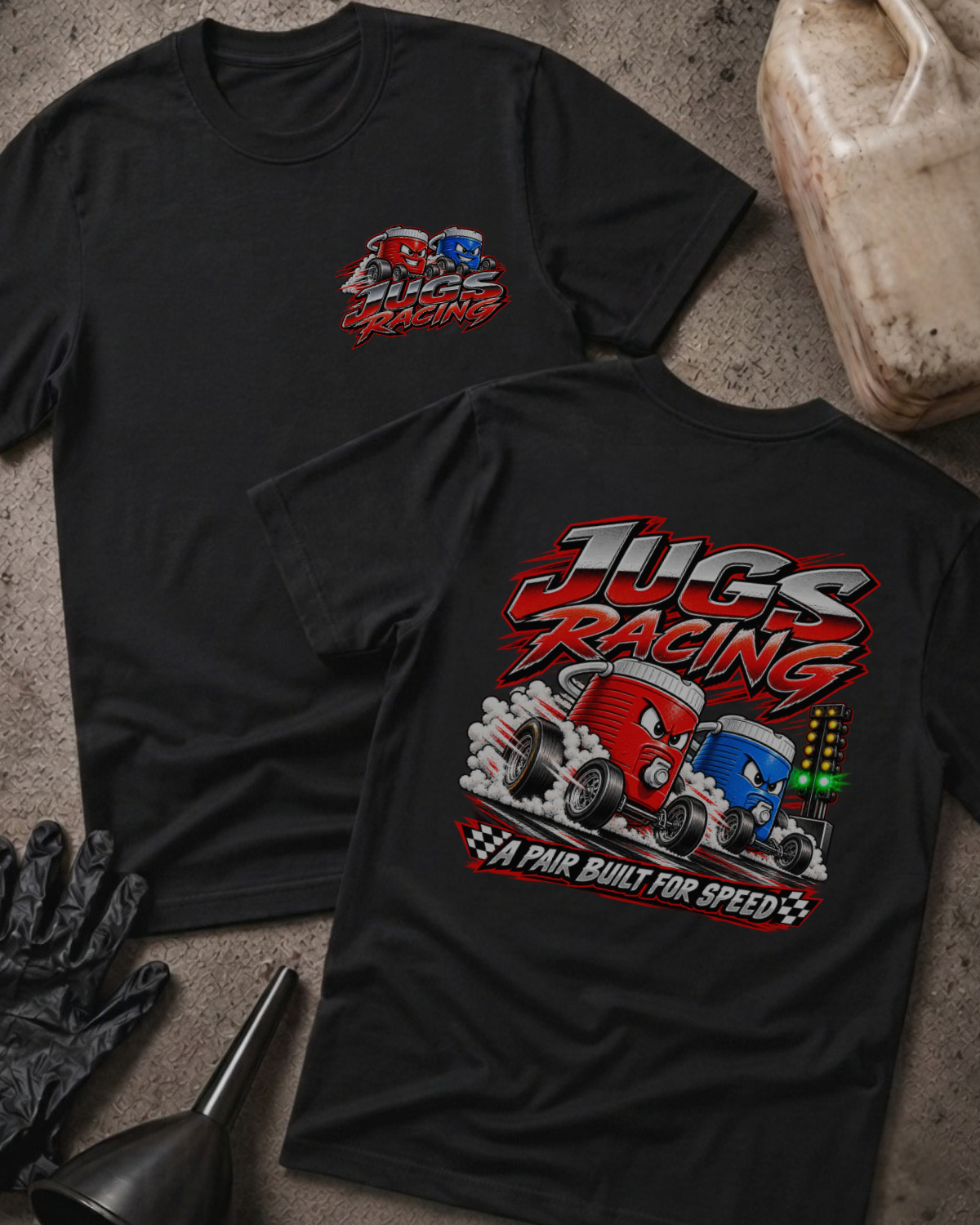 Black Jugs Racing T-shirt, front and back views featuring red and blue cartoon jugs drag racing beside a starting light, with the slogan “A pair built for speed.”