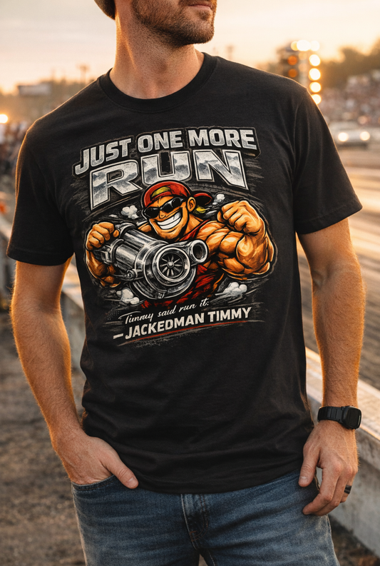 Man wearing a black t-shirt with a graphic design and 'Just One More Run Timmy Said Run It Jackedman Timmy' text, standing on a drag strip.