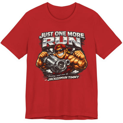 Red t-shirt with a graphic design of a muscular character holding a engine and text 'Just One More Run' on a white background.