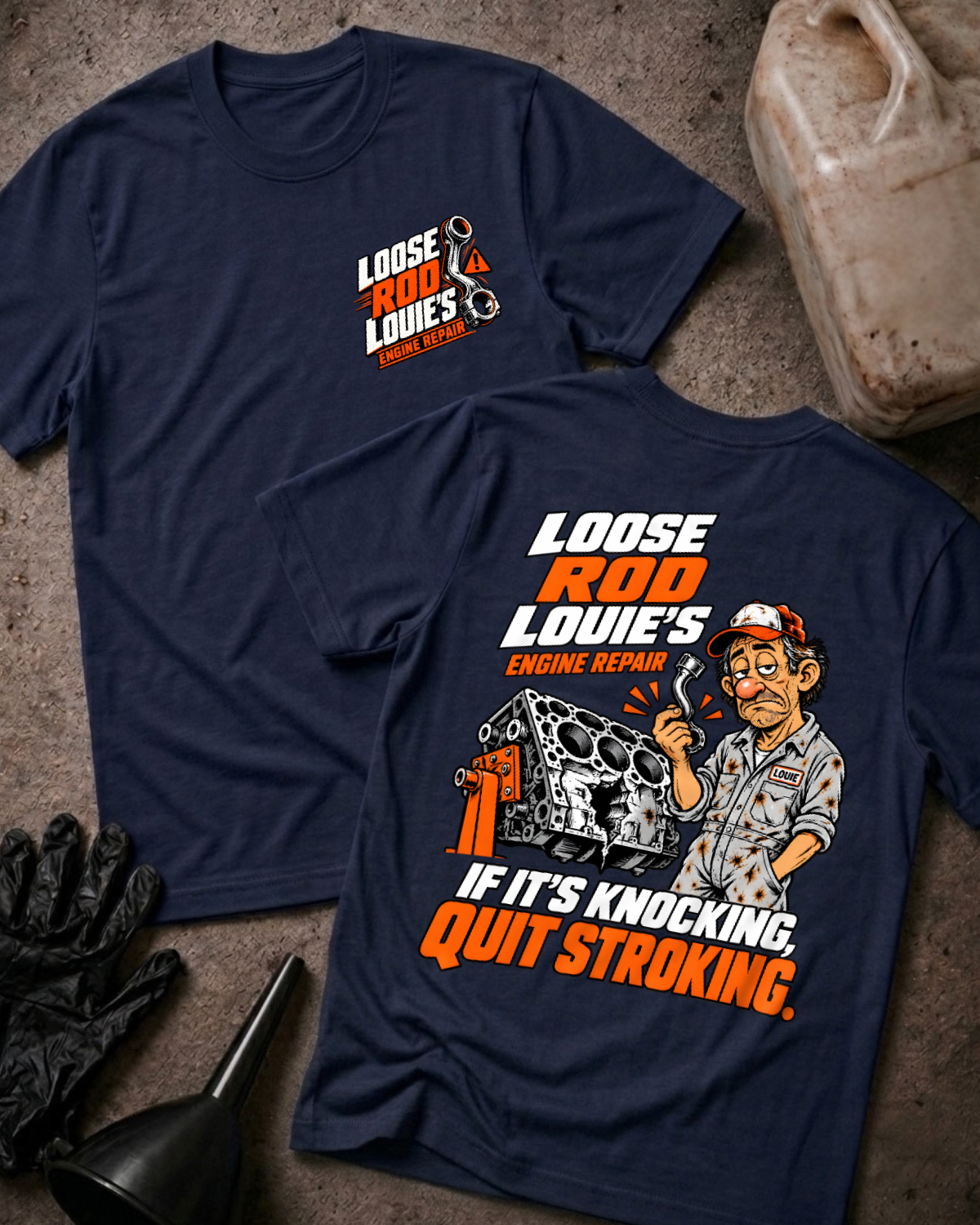 Navy Loose Rod Louie’s Engine Repair T-shirt, flat lay with the front chest logo and back cartoon mechanic and cracked engine block design reading “If It’s Knocking, Quit Stroking,” styled with gloves, a funnel, and an oil jug.