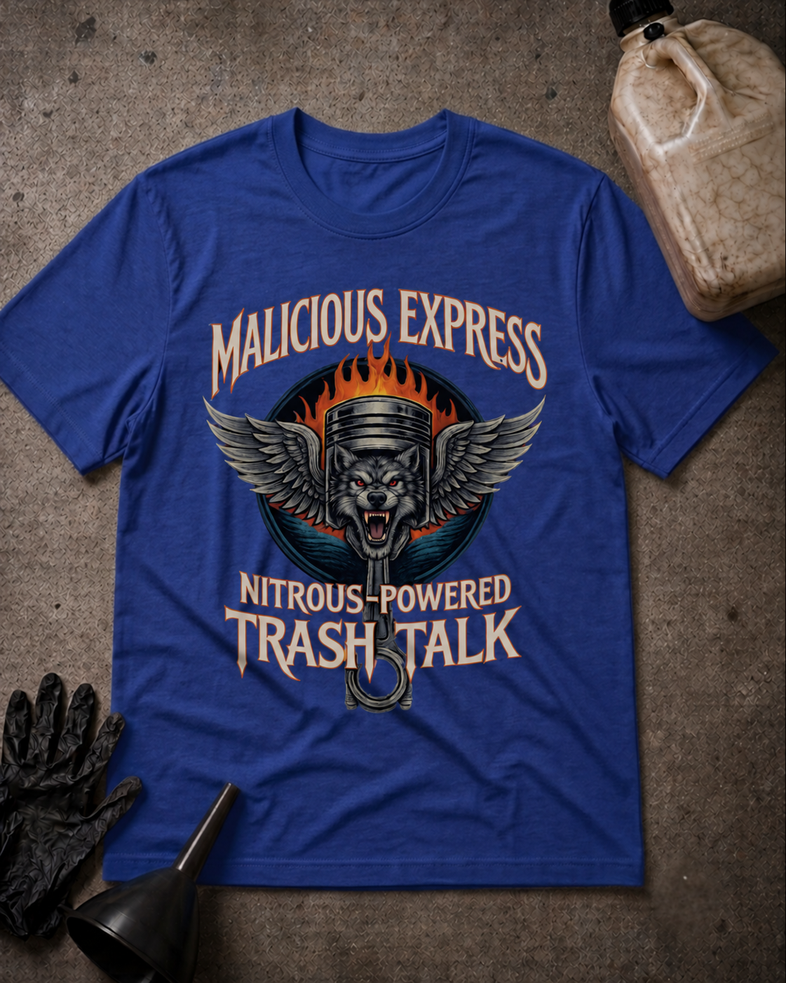 Malicious Express Wolf Piston Tee in True Royal, flat lay with an unbranded prop bottle.