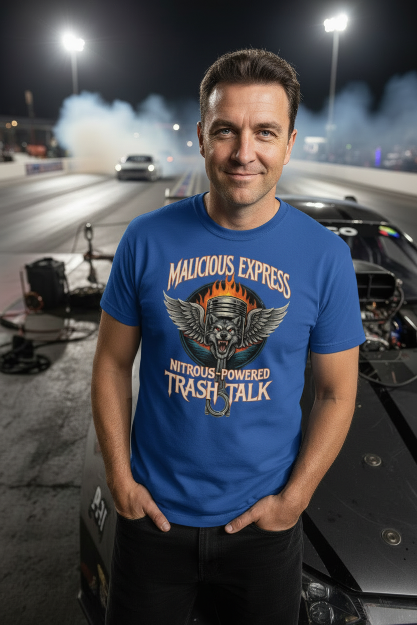 Man wearing a blue t-shirt with graphic design and 'Malicious Express Nitrous-Powered Trash Talk' text, standing on a racetrack with cars and smoke in the background.