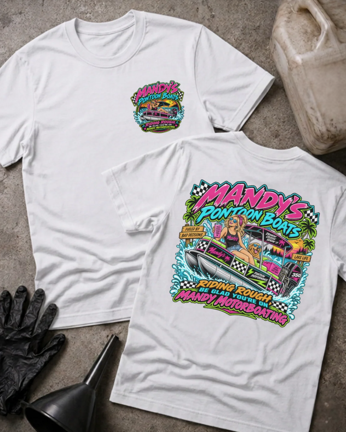 Front and back of Mandy’s Pontoon Boats white T-shirt with chest logo, woman and dog aboard a pontoon boat, and “Riding rough? Be glad you’re on Mandy Motorboating” slogan.