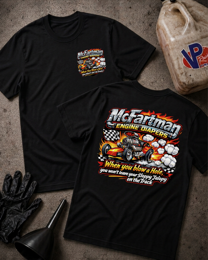 Two black short-sleeve t-shirts shown flat on a textured gray surface, displaying the front and back of a custom 'McFariman Engine Radiators' graphic. The graphic features a hot rod race car, flames, smoke, and the text 'When you blow a Hole you won't leave your Sloppy Jalopy on the Track.