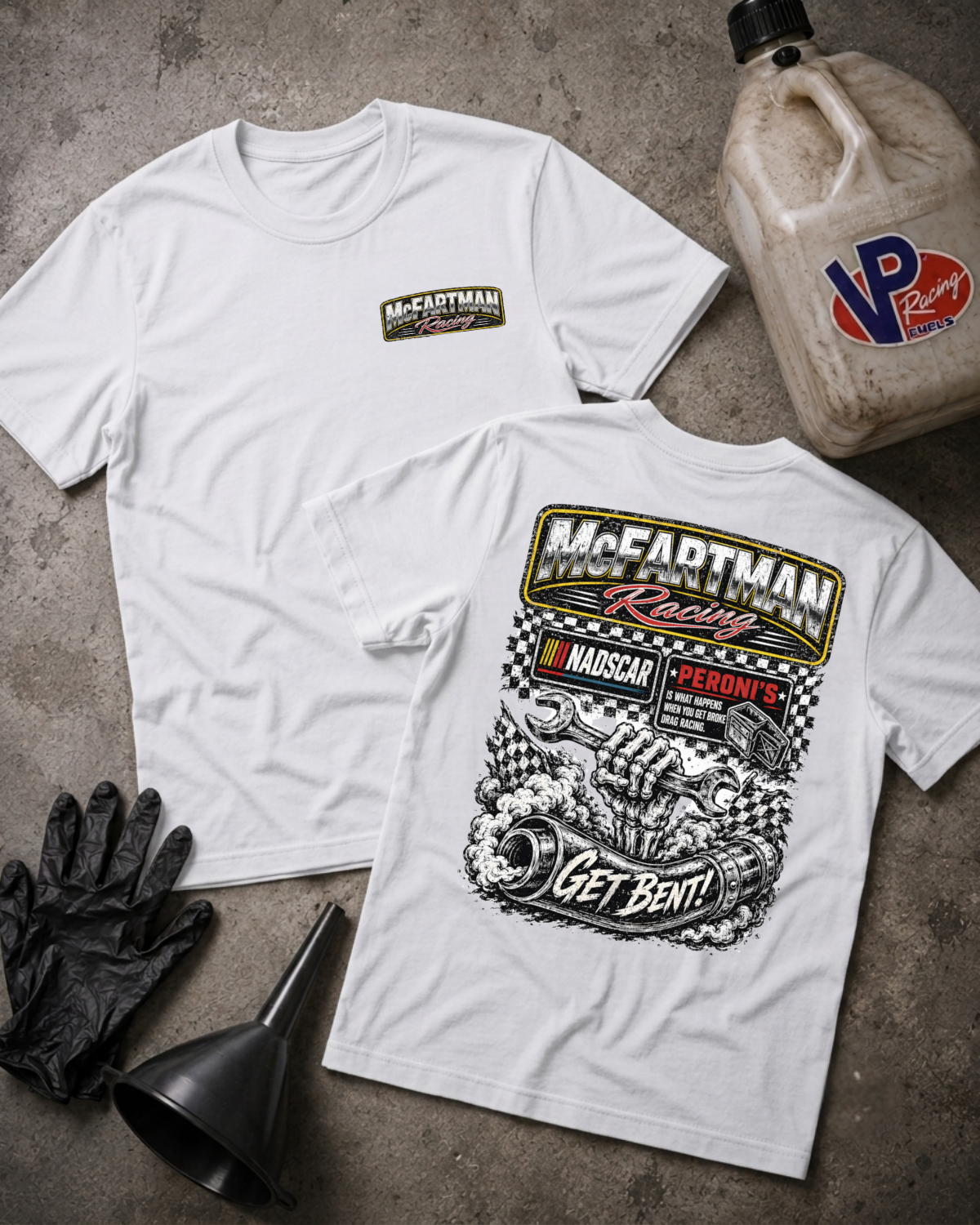 Two white short-sleeve t-shirts laid flat on a gray concrete surface, showing the front and back graphics. The front shirt has a small McFartman Racing logo on the left chest, and the back shirt has a large black-and-white racing illustration with the text 'McFartman Racing', 'Get Bent!', and NADSCAR branding.