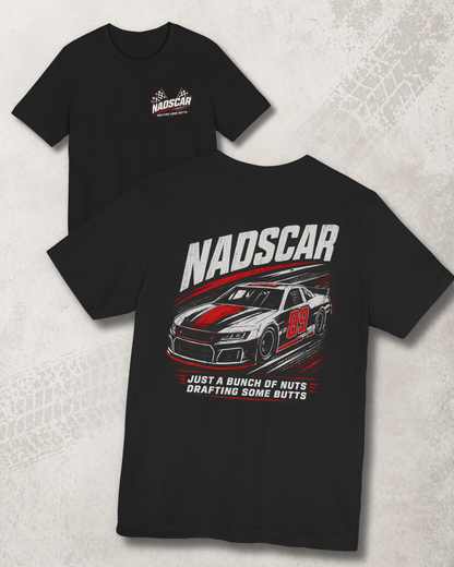 Black t-shirt with NADSCAR graphic and  'NADSCAR JUST A BUNCH OF NUTS DRAFTING SOME BUTTS' text on a textured gray background