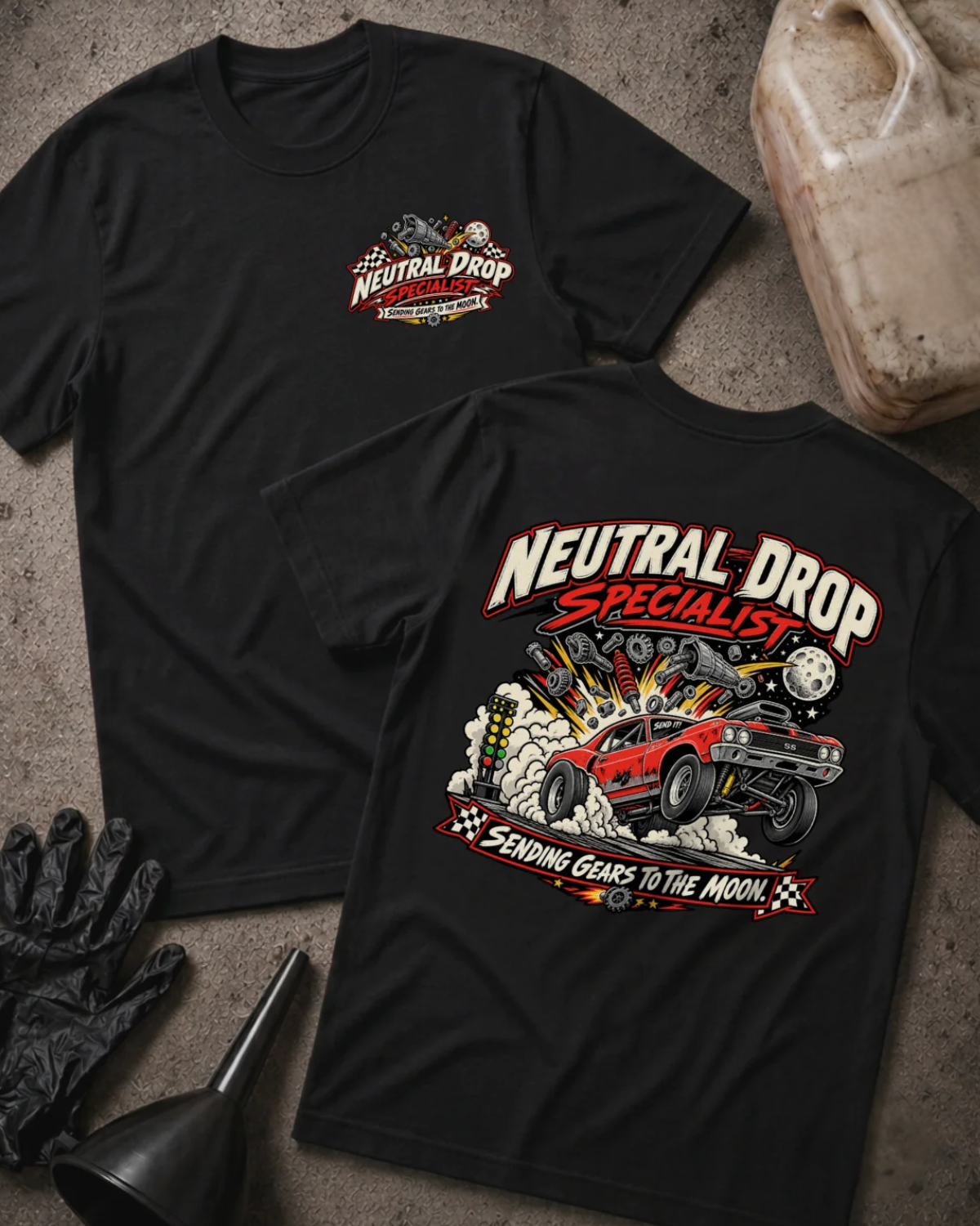 Front and back of Neutral Drop Specialist black T-shirt with chest logo, red muscle car launching amid smoke and flying gears, and “Sending gears to the moon!” slogan.