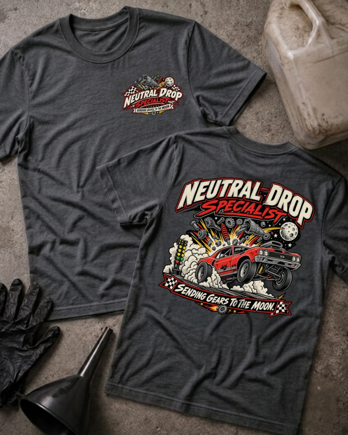 Front and back of Neutral Drop Specialist dark grey heather T-shirt with chest logo, red muscle car launching amid smoke and flying gears, and “Sending gears to the moon!” slogan.