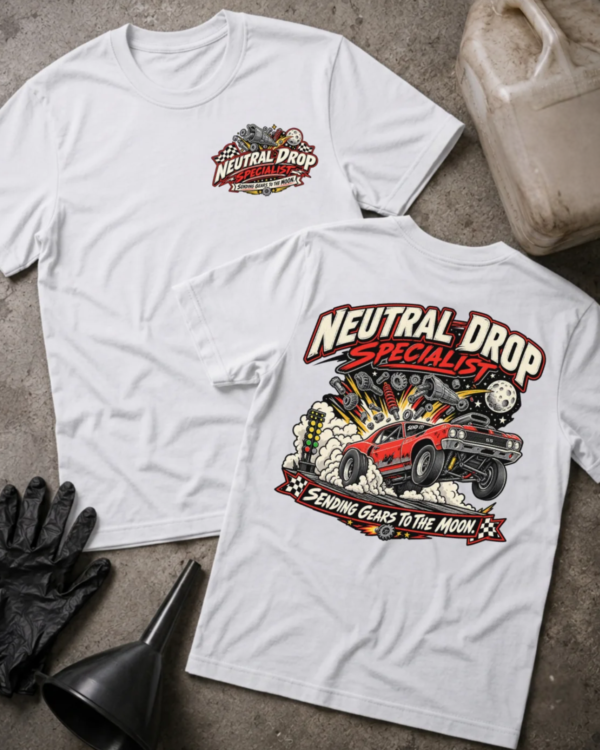 Front and back of Neutral Drop Specialist white T-shirt with chest logo, red muscle car launching amid smoke and flying gears, and “Sending gears to the moon!” slogan.