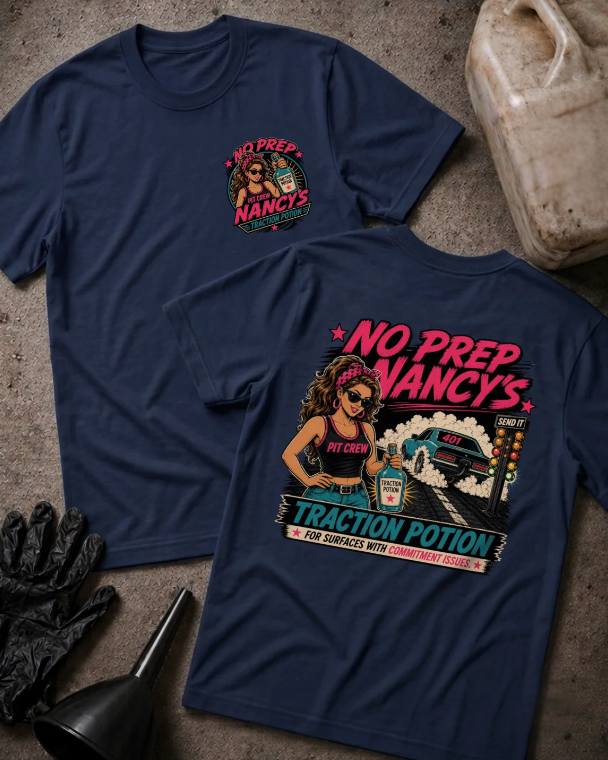 Front and back of No Prep Nancy’s navy T-shirt with chest logo, woman holding traction potion beside a drag car doing a burnout, and “For surfaces with commitment issues” slogan.