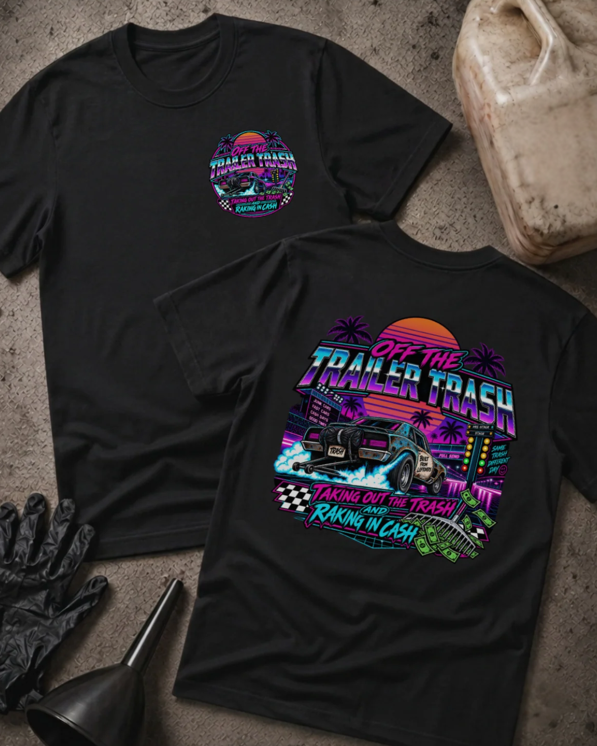 Front and back of Off the Trailer Trash black T-shirt with chest logo, drag car beneath a neon sunset and palm trees, and “Taking out the trash and raking in cash” slogan.
