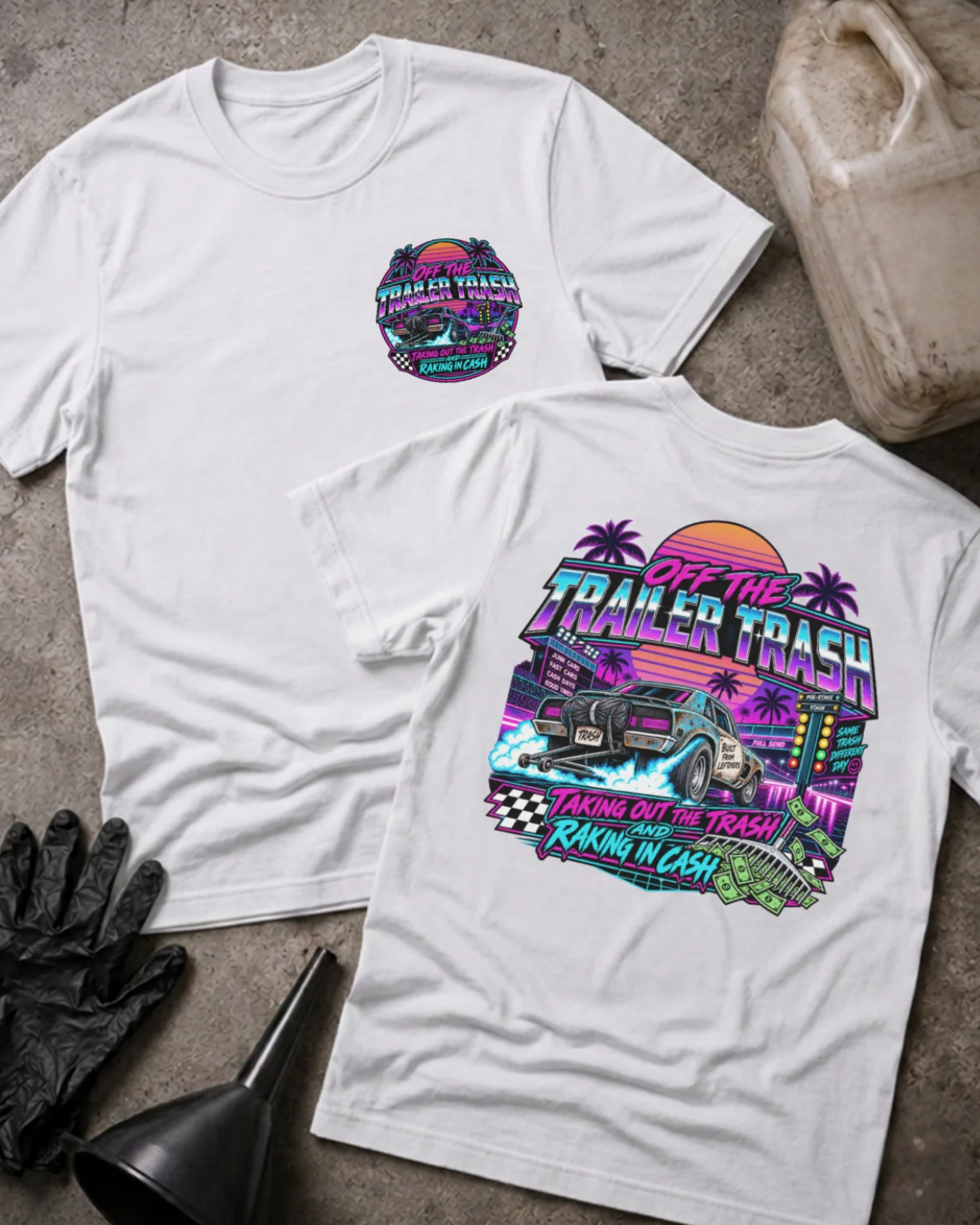 Front and back of Off the Trailer Trash white T-shirt with chest logo, drag car beneath a neon sunset and palm trees, and “Taking out the trash and raking in cash” slogan.⠋