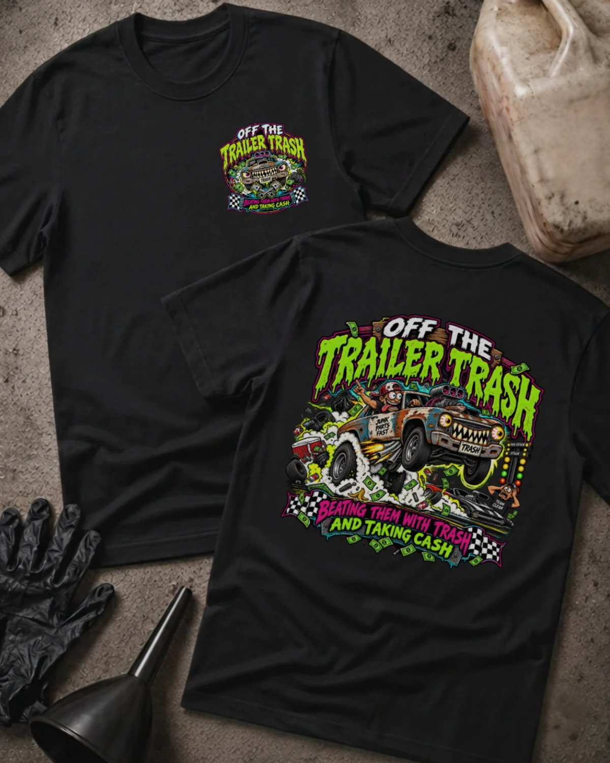 Front and back of Off the Trailer Trash black T-shirt with chest logo, rusty drag racing car amid smoke and cash, and “Beating them with trash and taking cash” slogan.