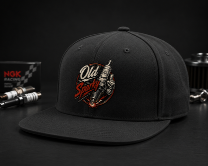Black cap with 'Old Sparky' logo on a dark background