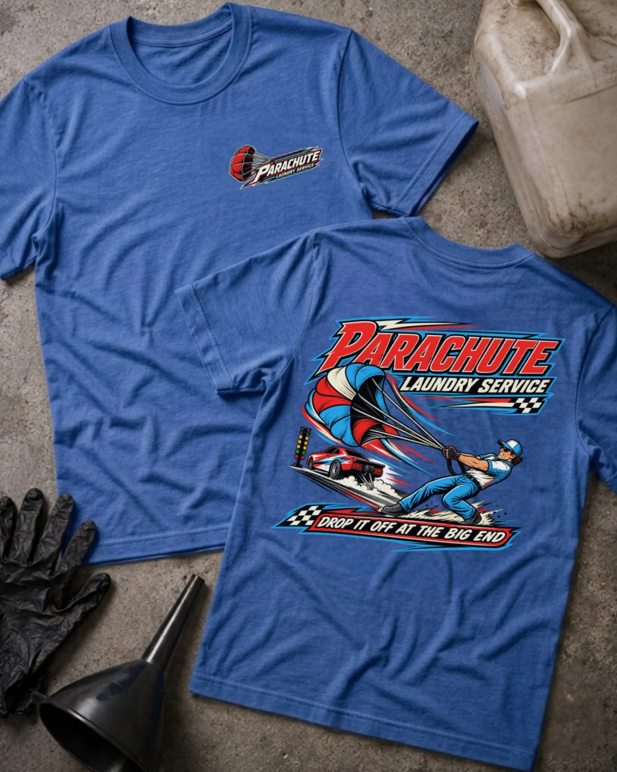 Front and back of Parachute Laundry Service heather true royal drag racing T-shirt with chest logo, crew member pulling a red, white and blue parachute beside a race car, and “Drop it off at the big end” slogan.