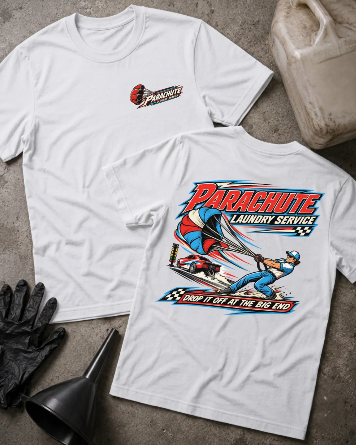 Front and back of Parachute Laundry Service white drag racing T-shirt with chest logo, crew member pulling a red, white and blue parachute beside a race car, and “Drop it off at the big end” slogan.