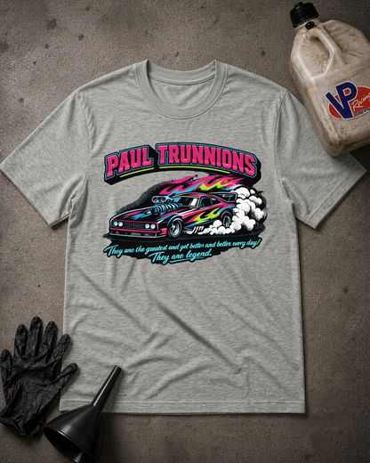 A heather gray graphic t-shirt featuring a colorful print of a race car and the text 'PAUL TRUNNIONS' and 'They are the greatest and get better and better every day They are legend.'