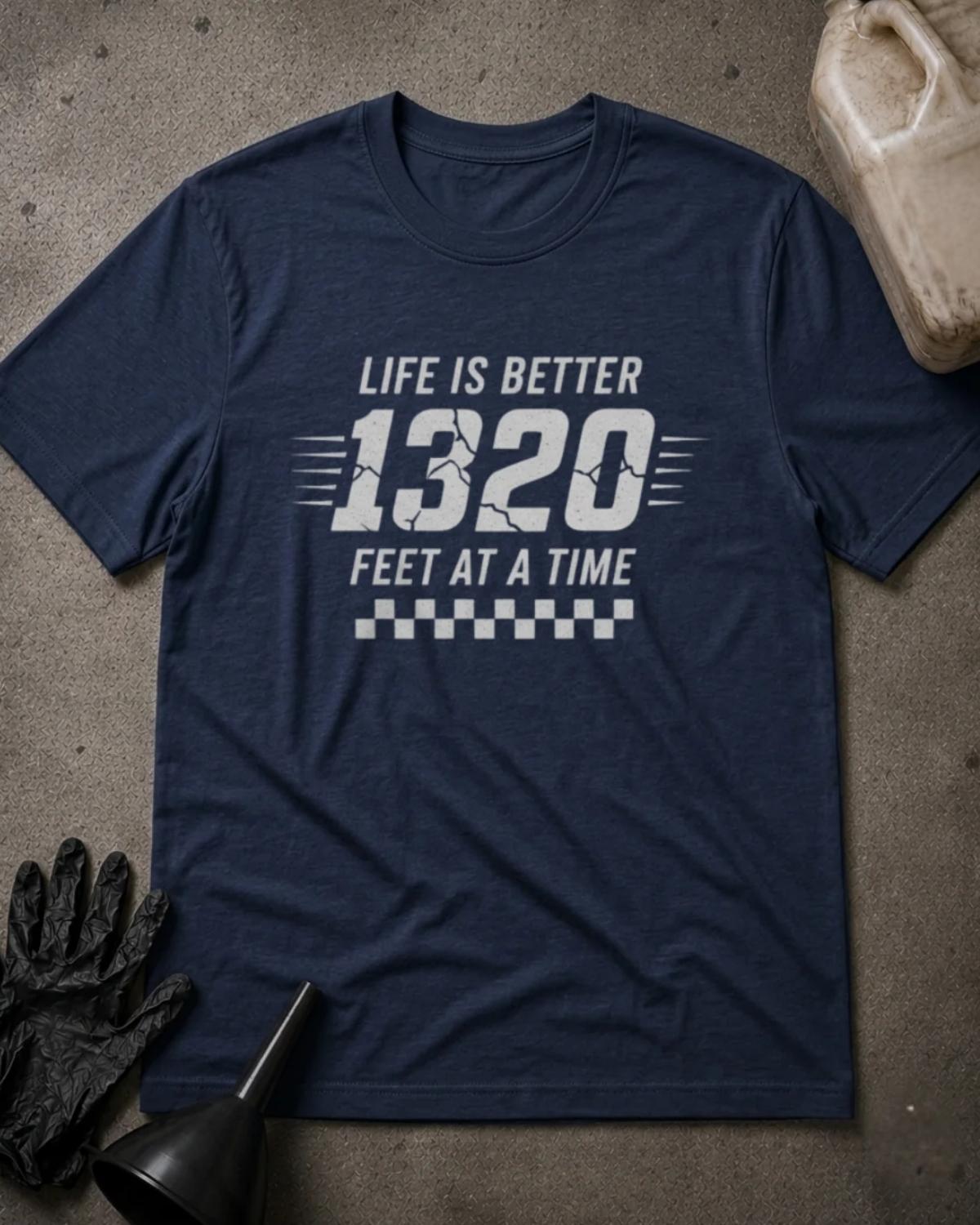 Navy 1320 Feet drag racing T-shirt featuring white “Life is better 1320 feet at a time” lettering, cracked-effect numbers, speed lines, and a checkered pattern.
