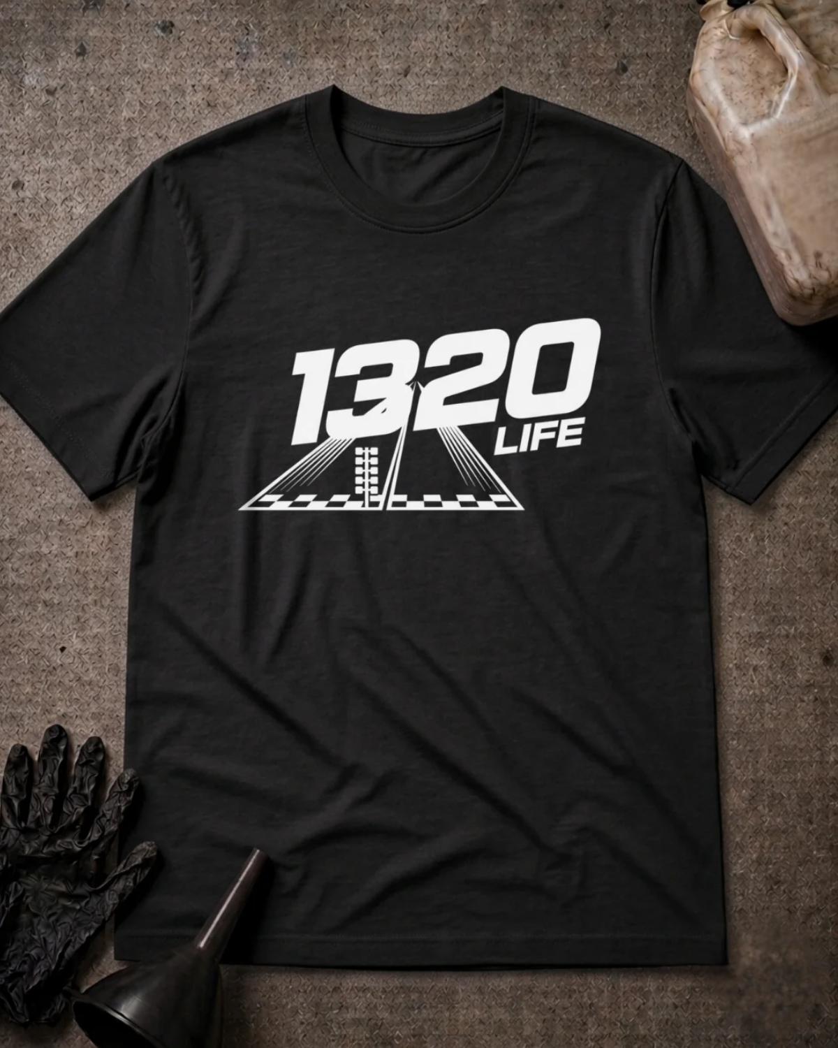 Black 1320 Life drag racing T-shirt featuring white “1320 Life” lettering above a drag strip graphic with a starting light and checkered line.
