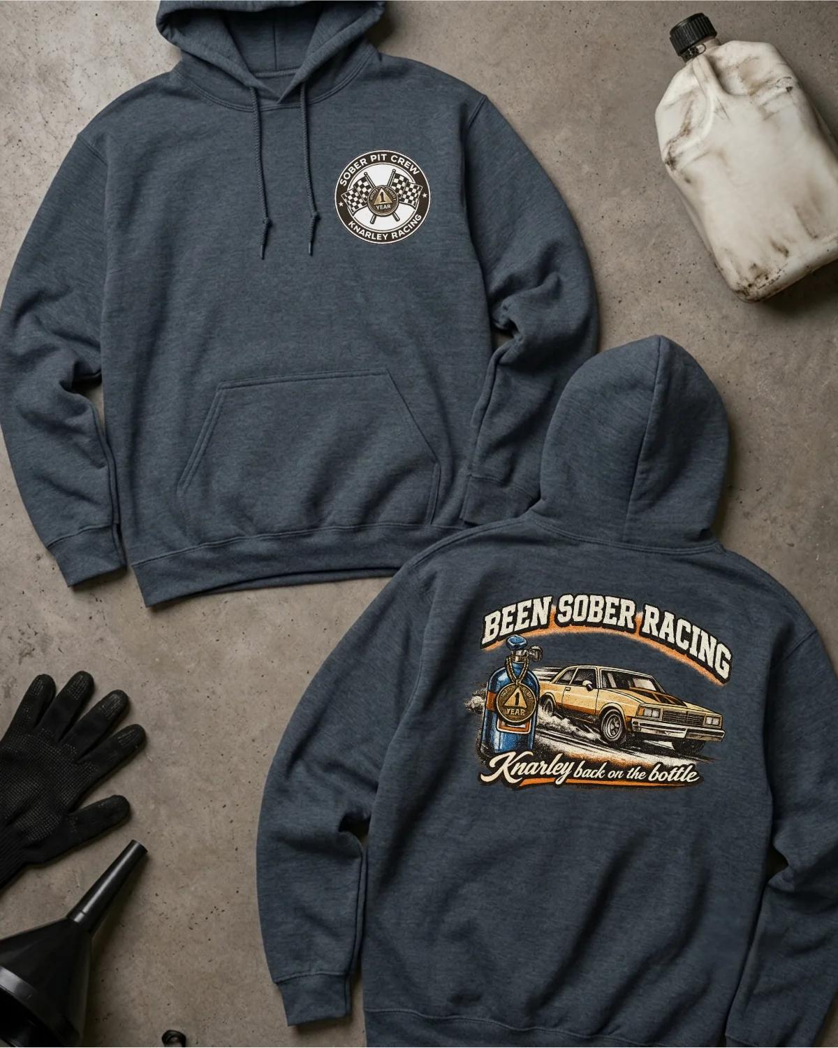 Front and back of dark heather Been Sober Racing hoodie with a Sober Pit Crew chest emblem and gold drag car beside a blue nitrous bottle, reading “Knarley Back on the Bottle.”