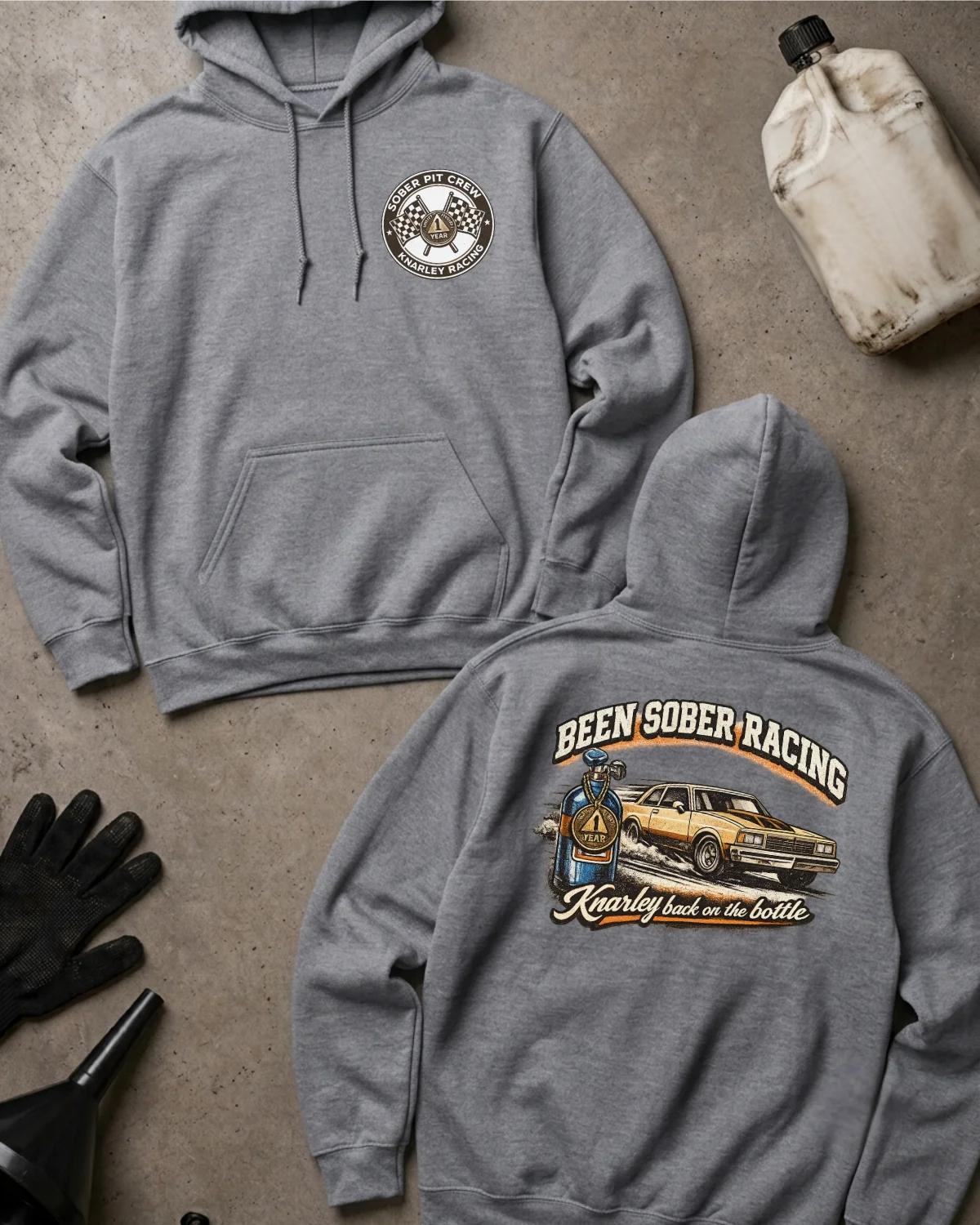Front and back of sport grey Been Sober Racing hoodie with a Sober Pit Crew chest emblem and gold drag car beside a blue nitrous bottle, reading “Knarley Back on the Bottle.”