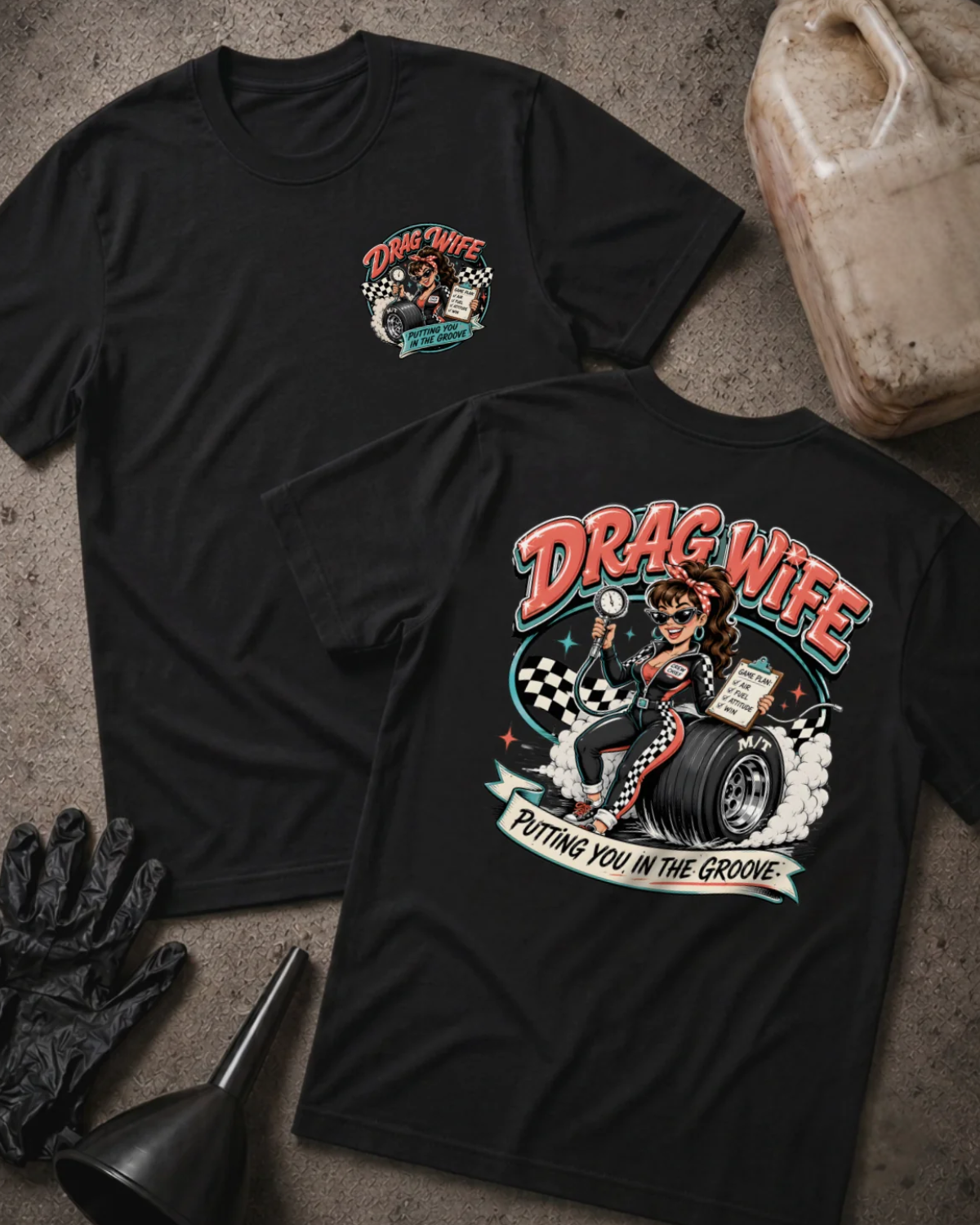 Front and back of black Drag Wife T-shirt with a small chest emblem and woman holding a tire pressure gauge and clipboard while seated on a racing tire on the back.