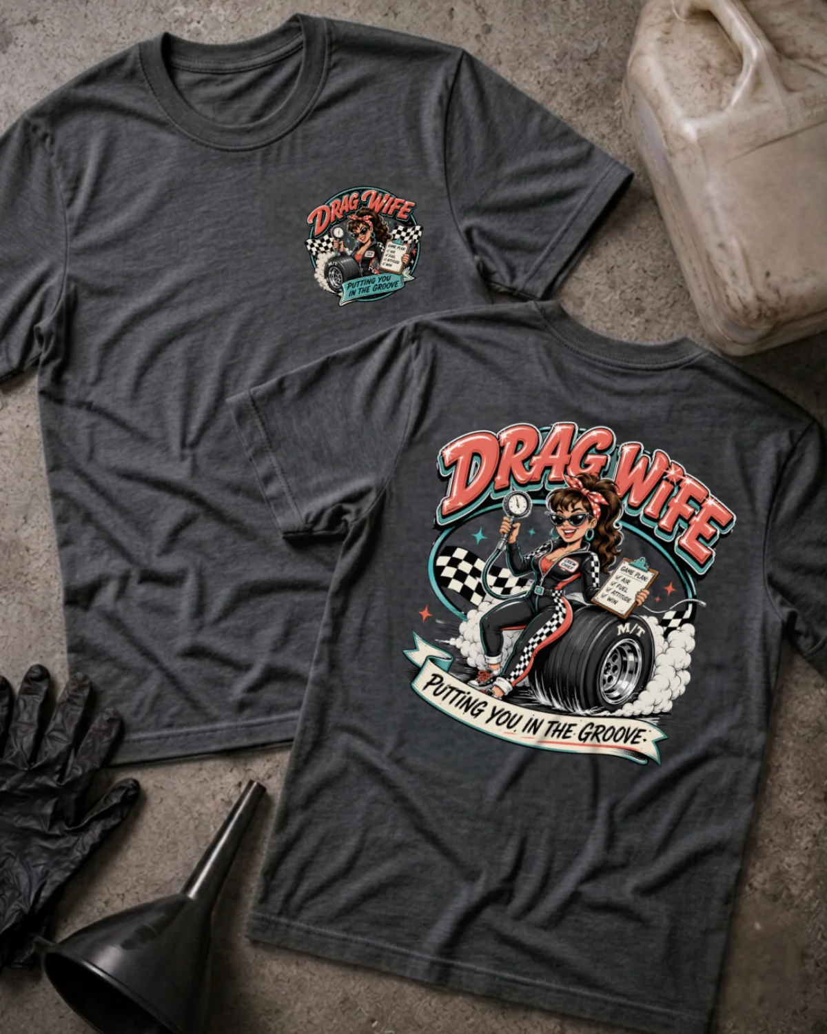 Front and back of dark grey heather Drag Wife T-shirt with a small chest emblem and woman holding a tire pressure gauge and clipboard on a racing tire back print.