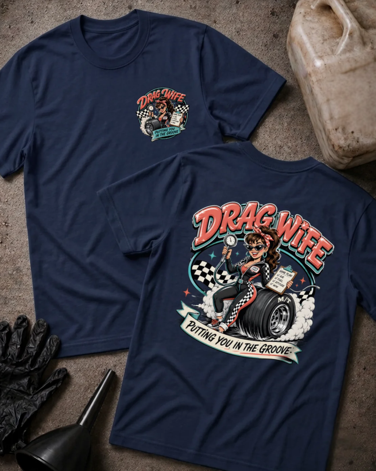 Front and back of navy Drag Wife T-shirt with a small chest emblem and woman holding a tire pressure gauge and clipboard while seated on a racing tire on the back.