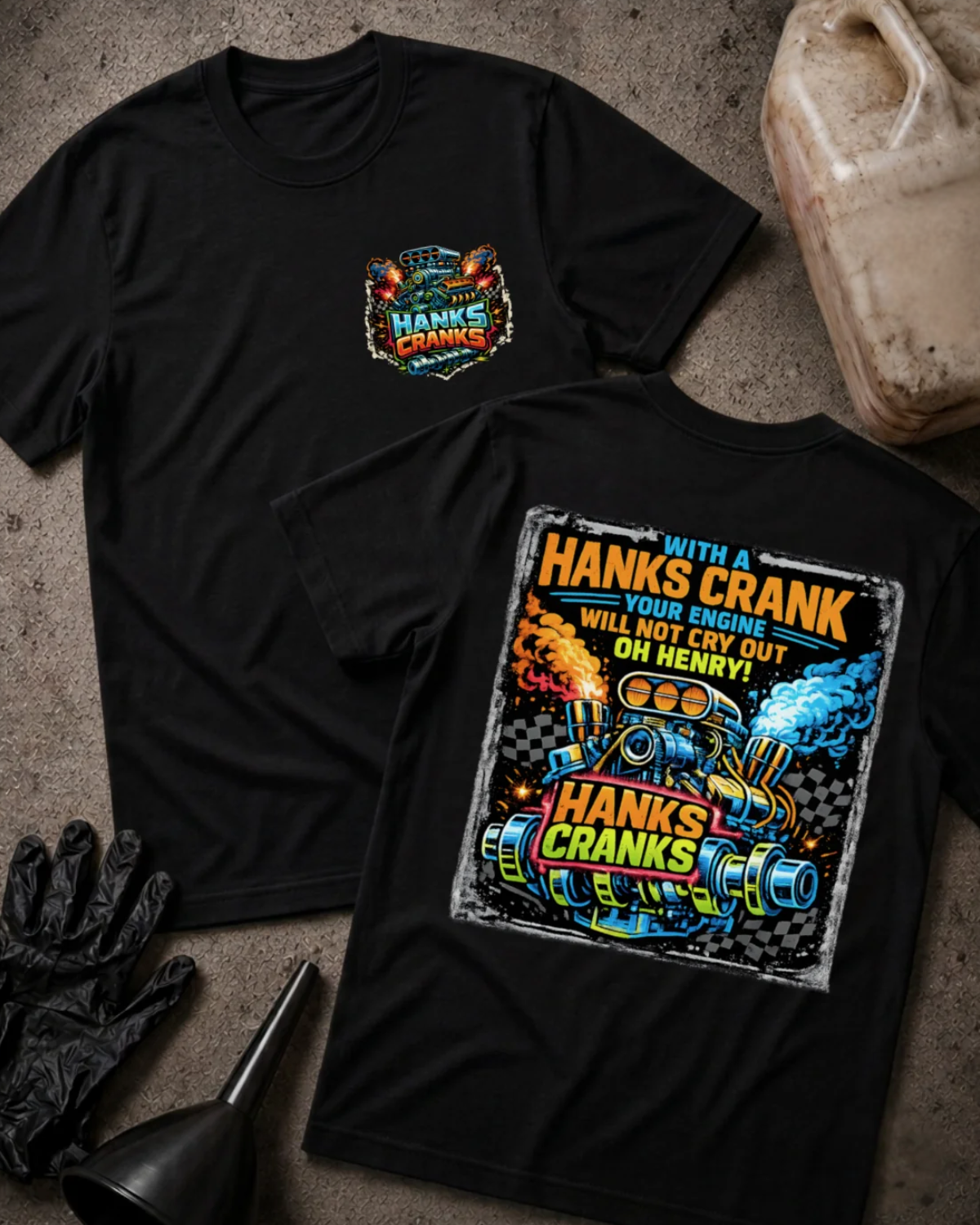 Front and back of black Hanks Cranks T-shirt with a small engine chest emblem and colorful racing engine and crankshaft back graphic with checkered flags, orange flames and blue smoke.