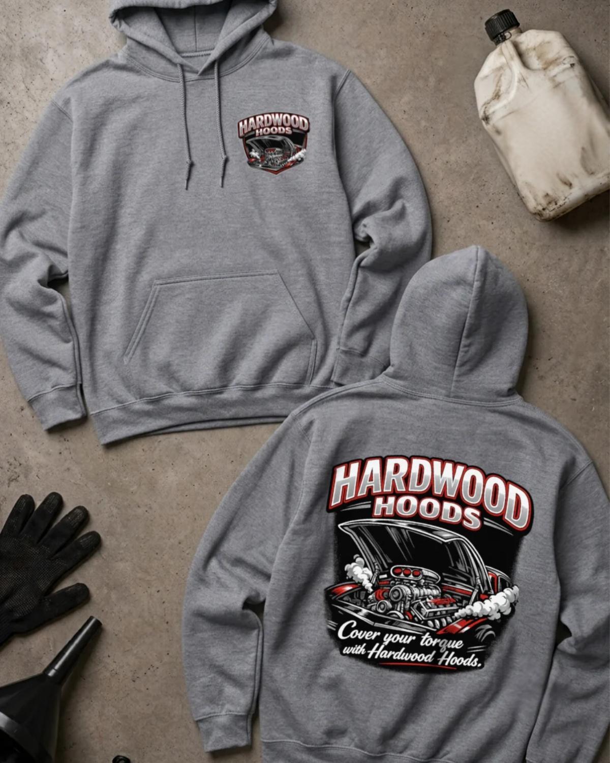 Front and back of sport grey Hardwood Hoods hoodie with a chest emblem and raised car hood revealing a supercharged racing engine, reading “Cover Your Torque with Hardwood Hoods.”