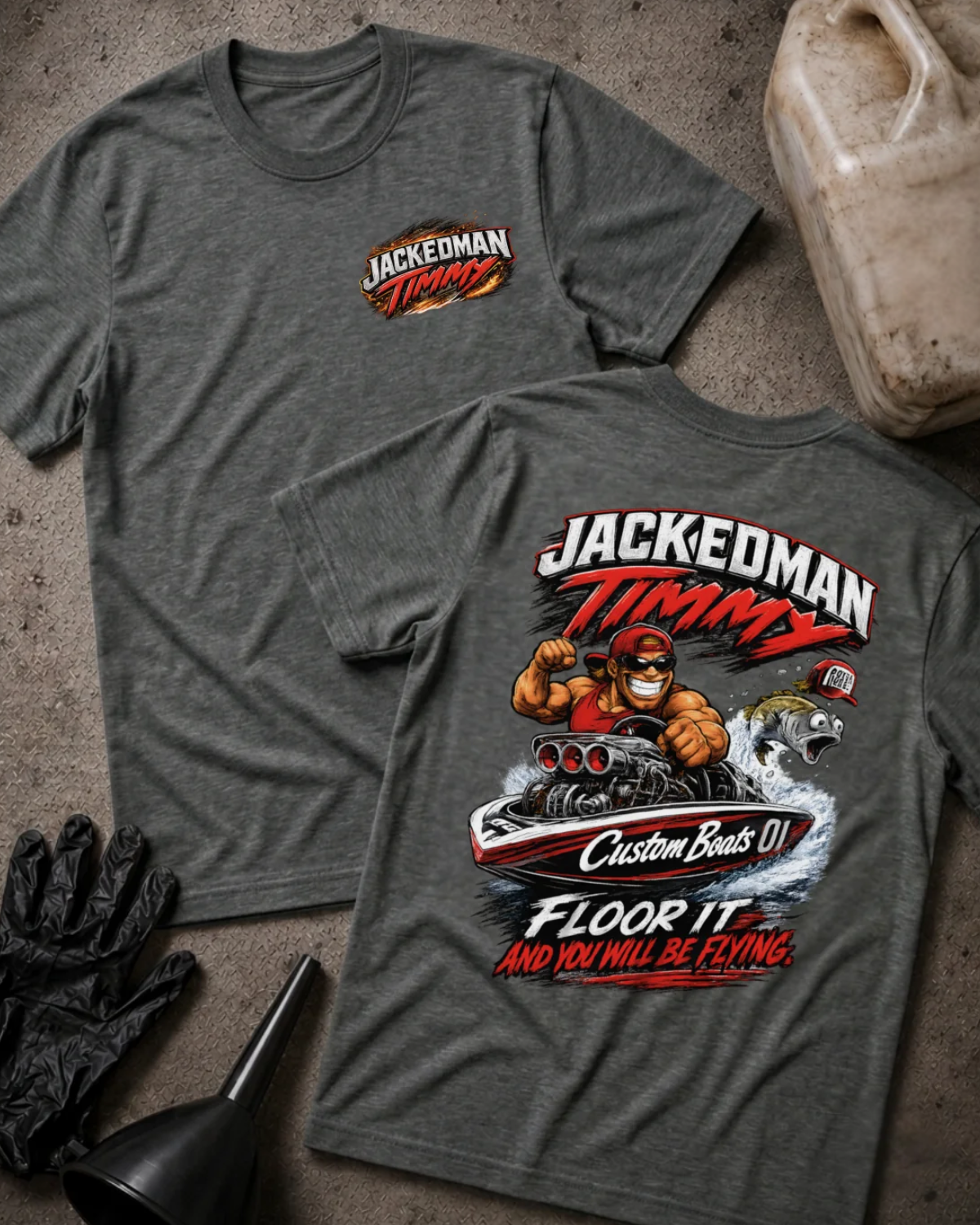 Front and back of dark grey heather Jackedman Timmy T-shirt with a chest logo and cartoon muscular driver in a drag racing boat beside a leaping fish on the back.