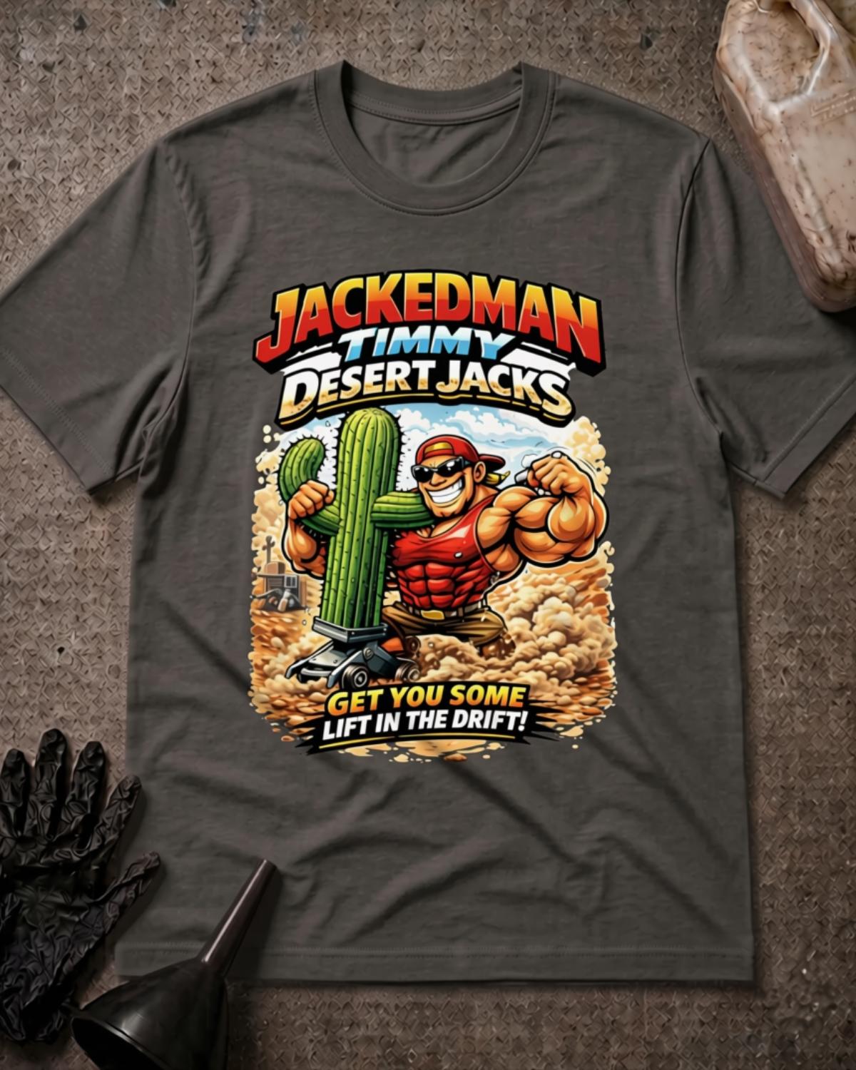 Asphalt gray Jackedman Timmy Desert Jacks T-shirt featuring a muscular cartoon man in sunglasses beside a cactus on a floor jack, with a dusty desert background and “Get you some lift in the drift!”