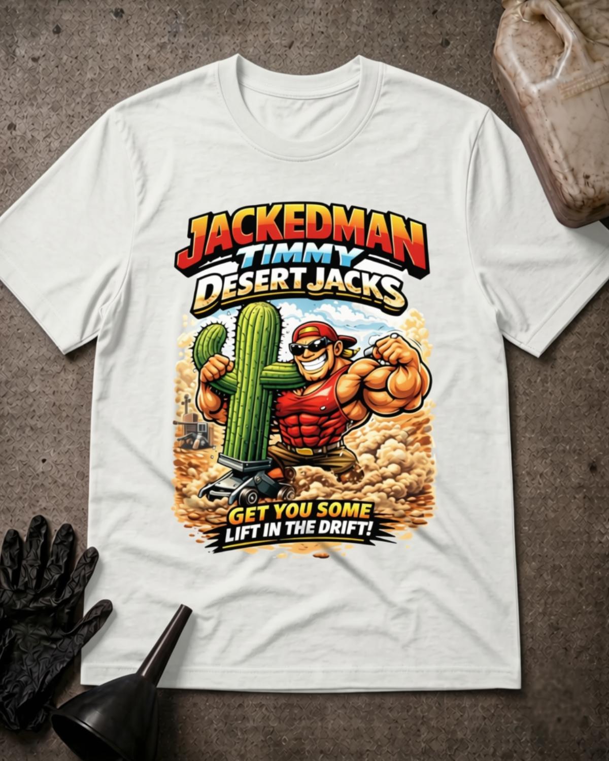 White Jackedman Timmy Desert Jacks T-shirt featuring a muscular cartoon man in sunglasses beside a cactus on a floor jack, with a dusty desert background and “Get you some lift in the drift!”