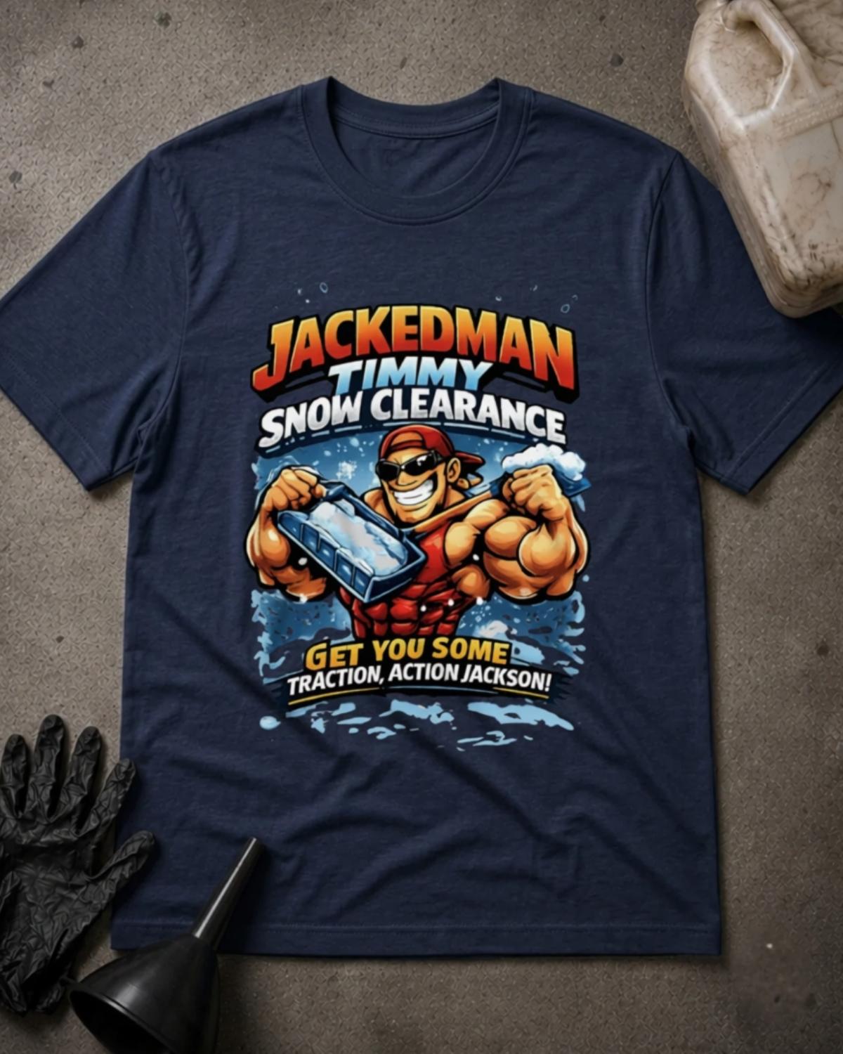 Navy Jackedman Timmy Snow Clearance T-shirt featuring a muscular cartoon man in sunglasses and a backward red cap holding a snow shovel, with the slogan “Get you some traction, Action Jackson!”