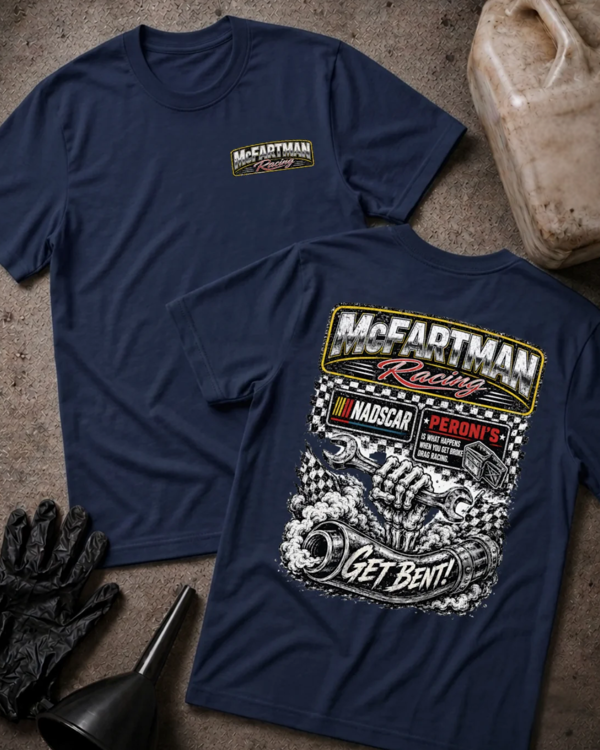 Front and back of navy McFartman Racing T-shirt with a chest logo and skeletal hand holding a wrench above a bent exhaust pipe, checkered flags and “Get Bent!” text.