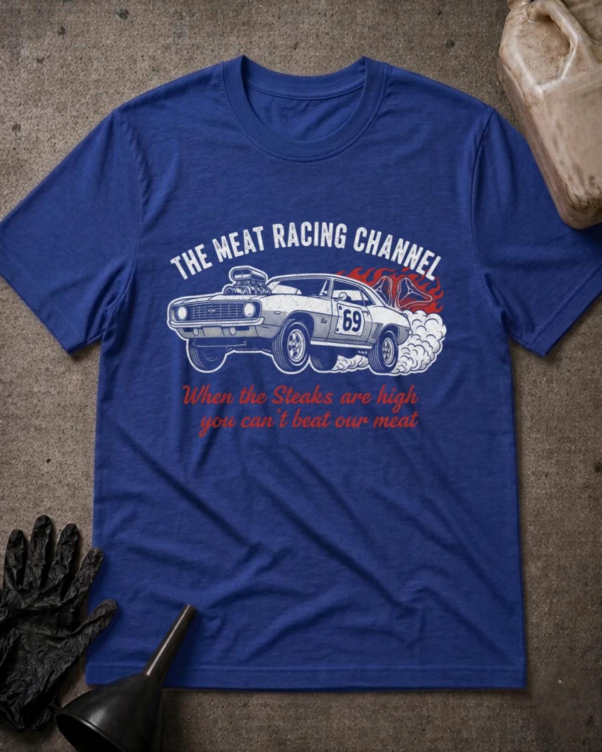 True Royal blue Meat Racing Channel T-shirt featuring a supercharged muscle car numbered 69, tire smoke, a flaming steak, and the slogan “When the steaks are high you can’t beat our meat.”