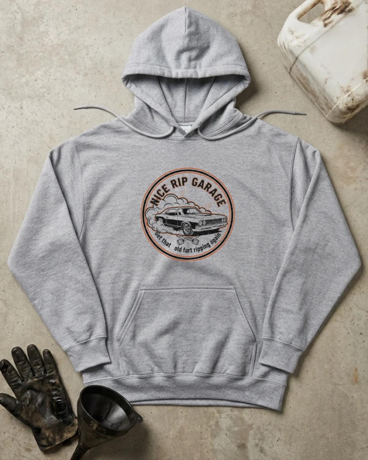 Front of sport grey hoodie with a circular Nice Rip Garage logo featuring a classic muscle car amid tire smoke and “Get That Old Fart Ripping again"