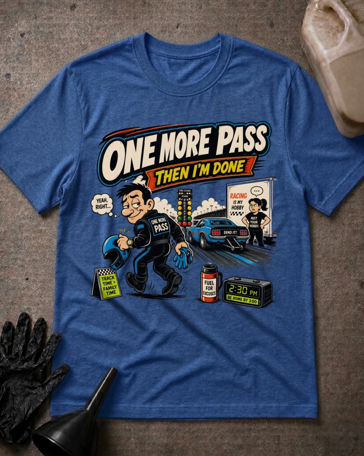 Front of heather true royal blue T-shirt with a cartoon racer holding a helmet, blue drag car and woman beside a trailer, reading “One More Pass, Then I’m Done.”