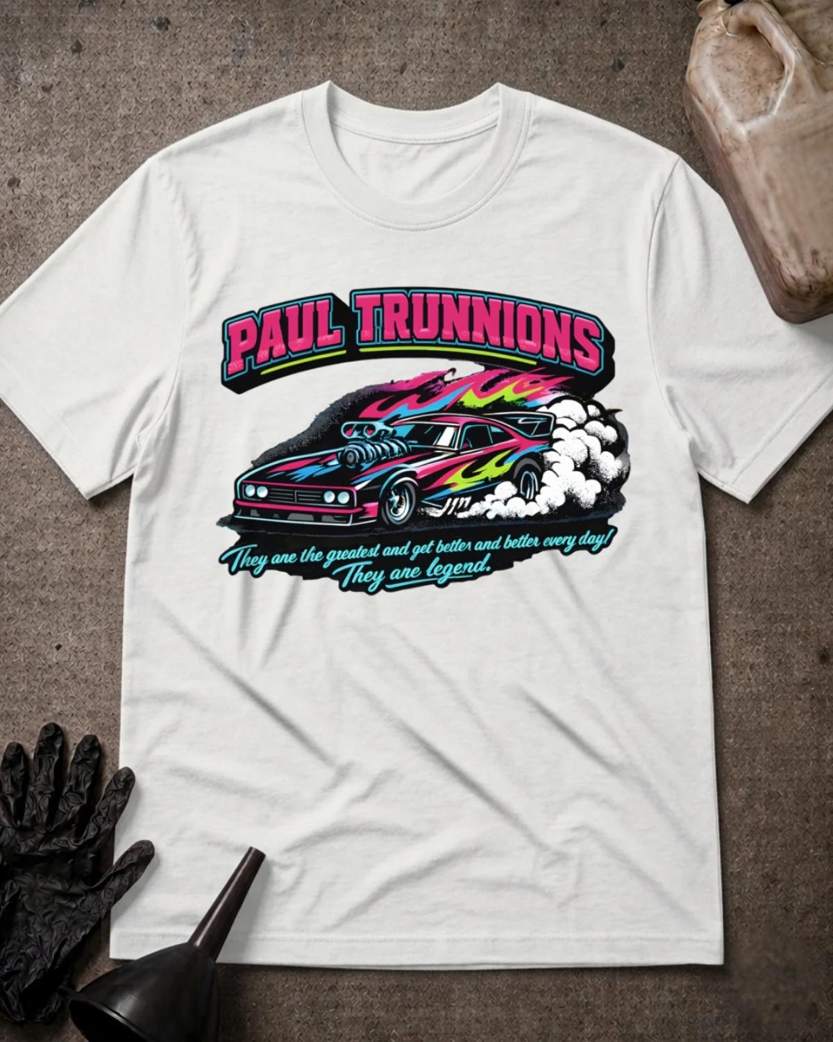 Front of white Paul Trunnions T-shirt with pink lettering above a supercharged drag car with pink, blue and lime flame graphics amid white tire smoke.