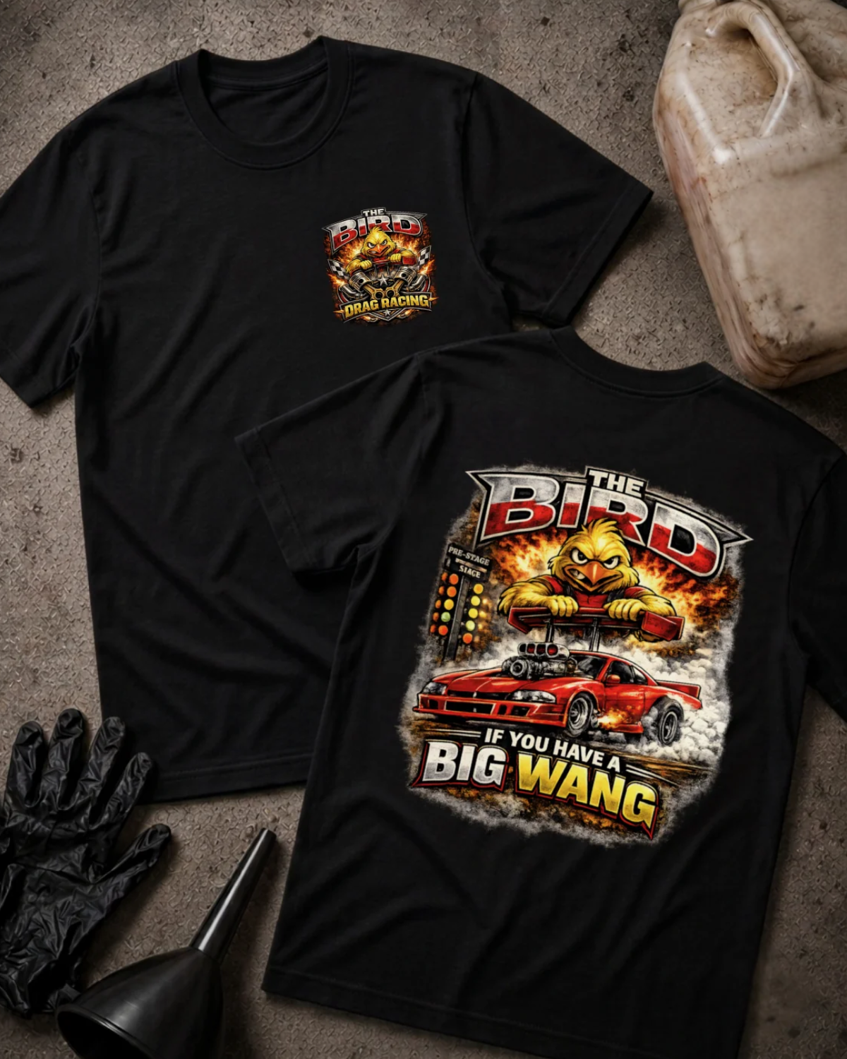 Front and back of black The Bird drag racing T-shirt with a chest emblem and cartoon yellow bird gripping a rear spoiler above a red drag car and starting tree.