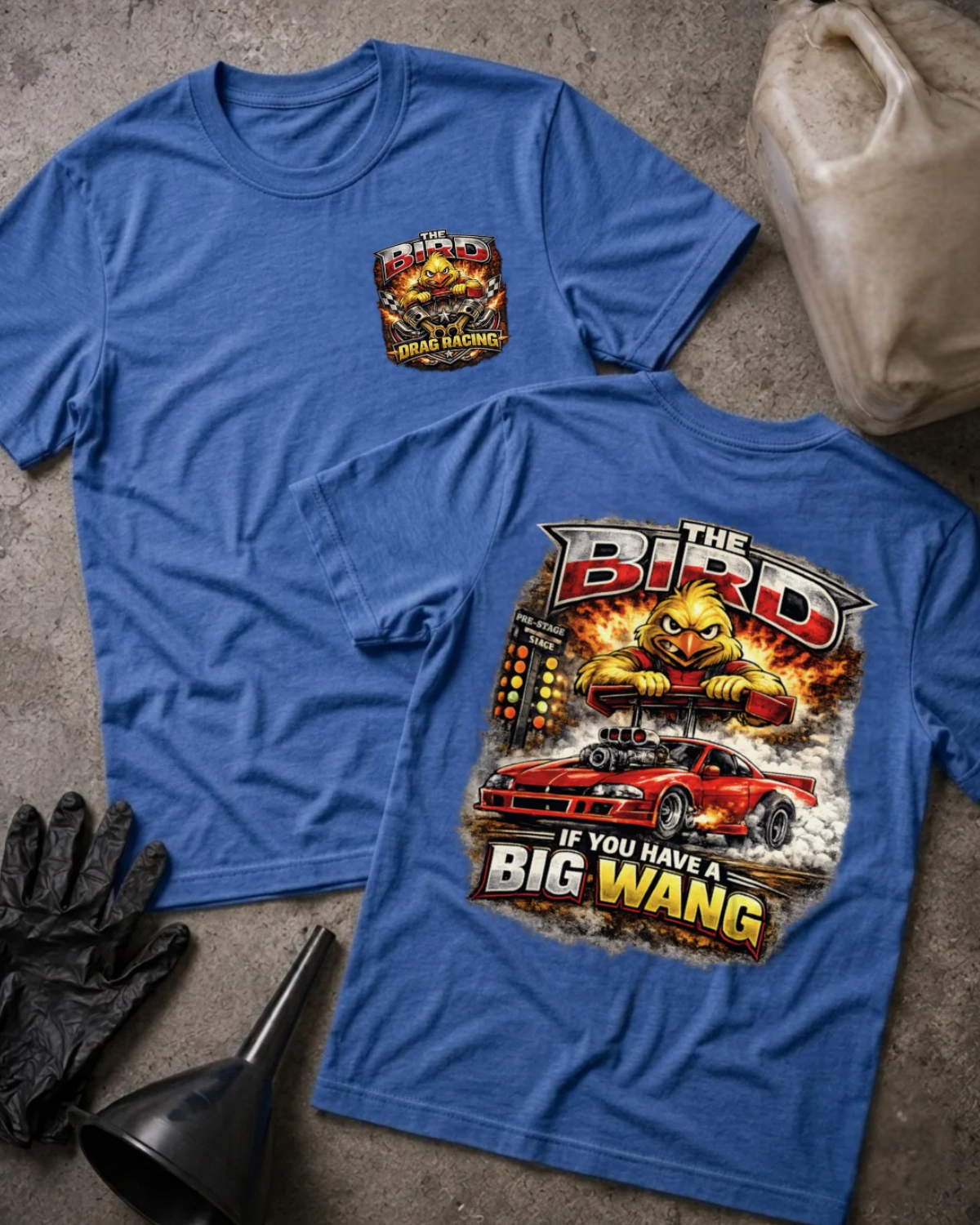Front and back of heather true royal blue The Bird drag racing T-shirt with a chest emblem and cartoon yellow bird gripping a rear spoiler above a red drag car and starting tree.
