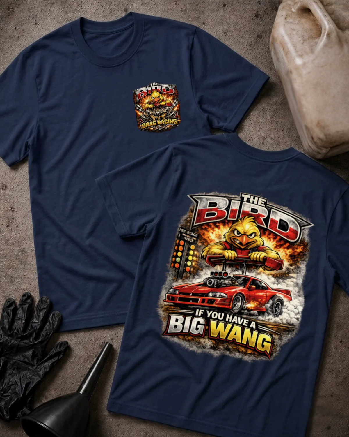Front and back of navy The Bird drag racing T-shirt with a chest emblem and cartoon yellow bird gripping a rear spoiler above a red drag car and starting tree.