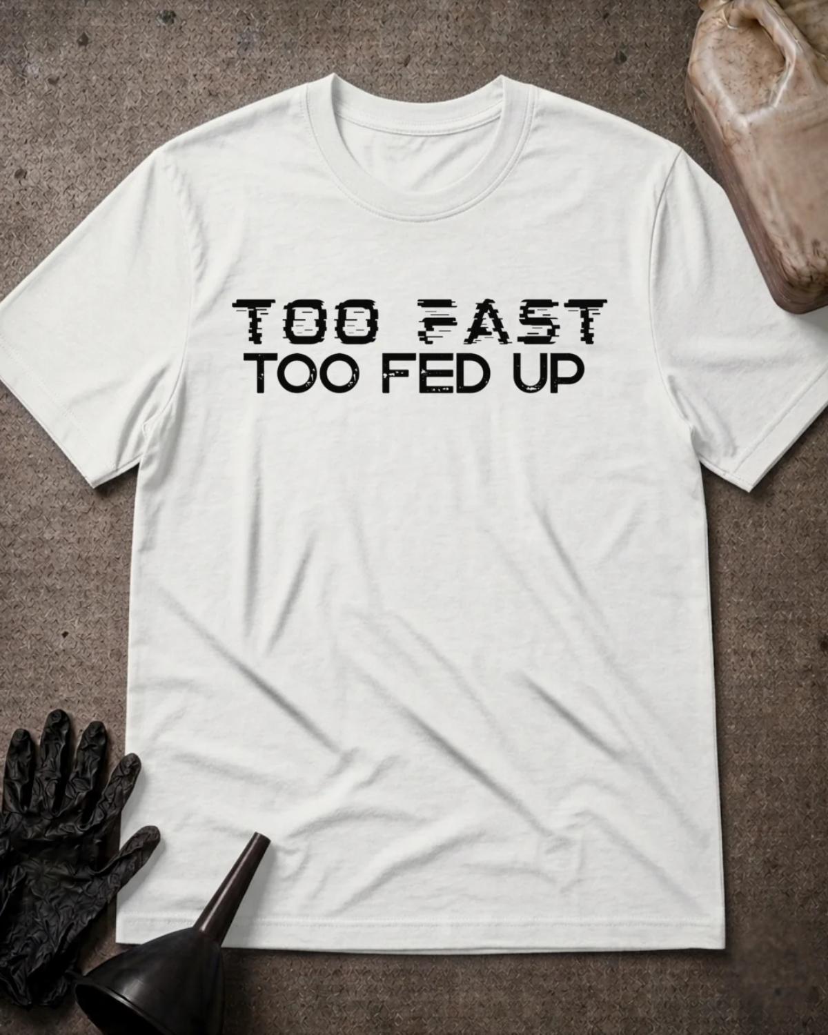 White Too Fast Too Fed Up T-shirt featuring black “Too fast, too fed up” lettering, with a distressed speed-line effect on “Too fast.”⠋